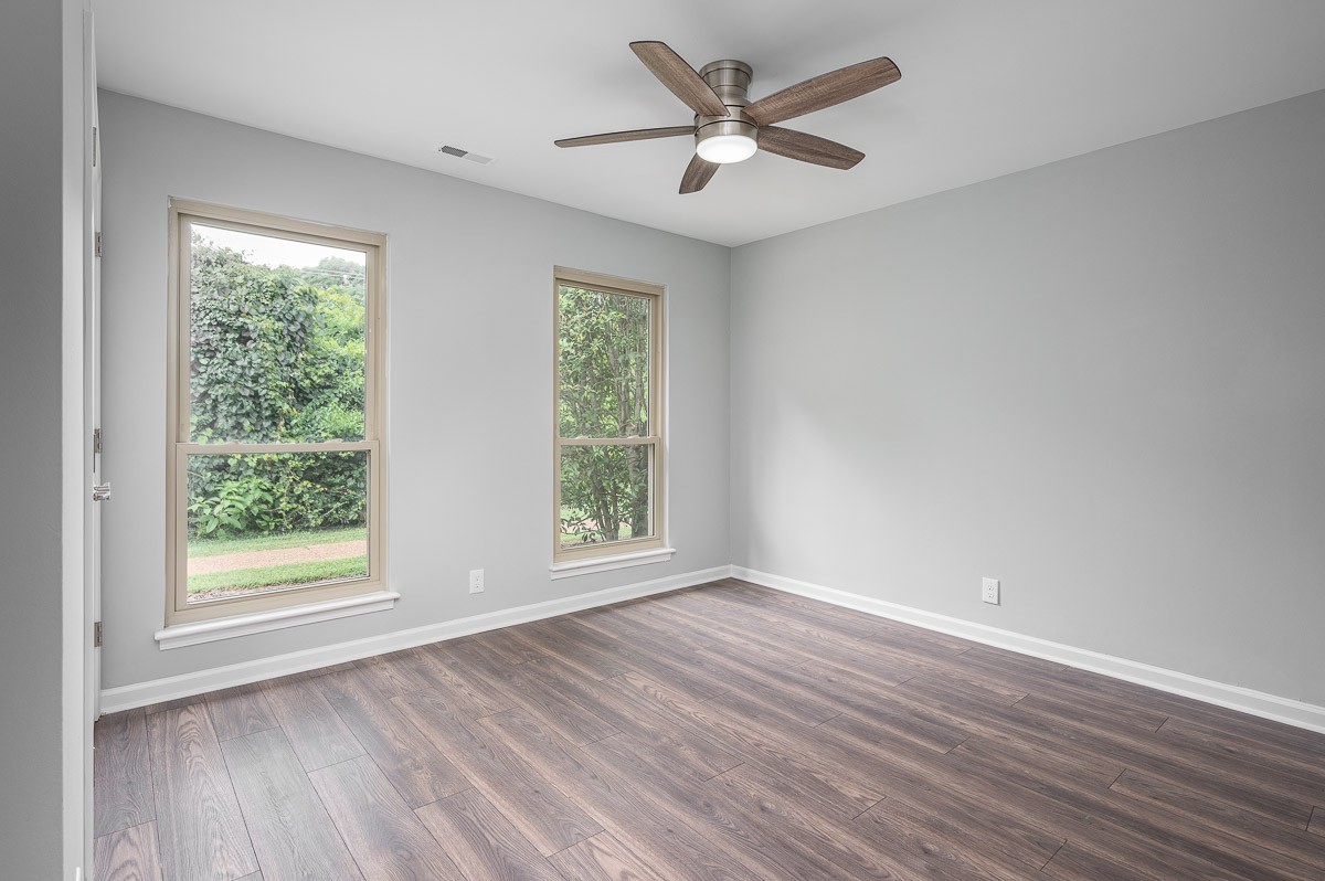 847 General George Patton Road Nashville, TN 37221 - Photo 32 of 41 a view of an empty room with wooden floor and a window