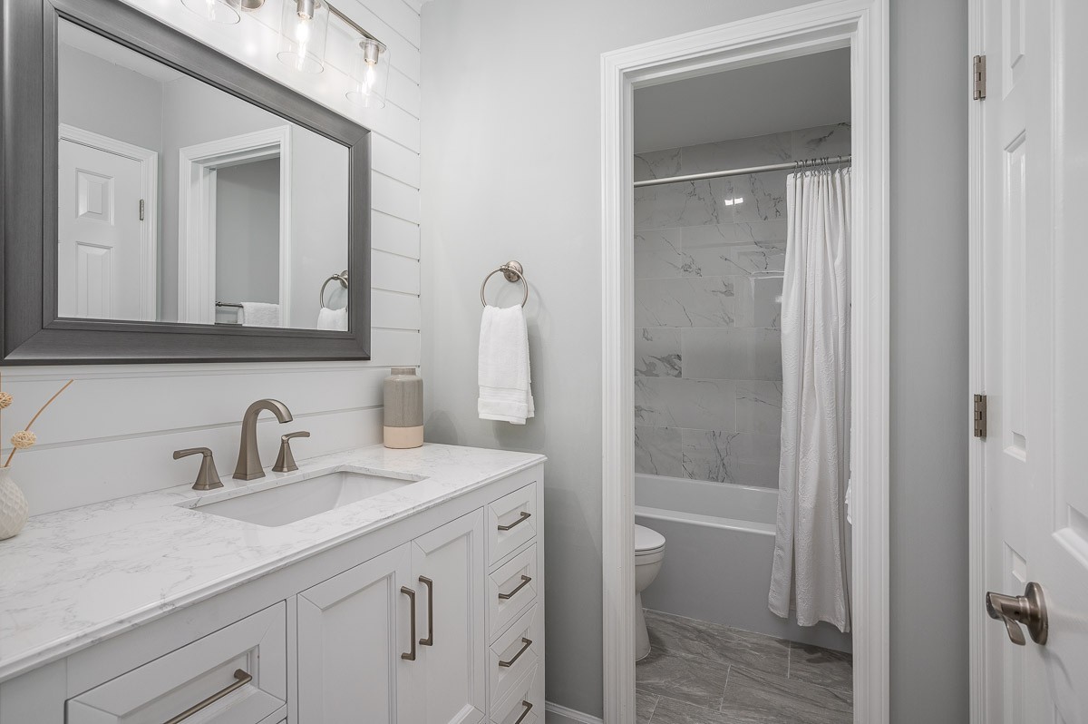 847 General George Patton Road Nashville, TN 37221 - Photo 35 of 41 a bathroom with a shower sink and mirror