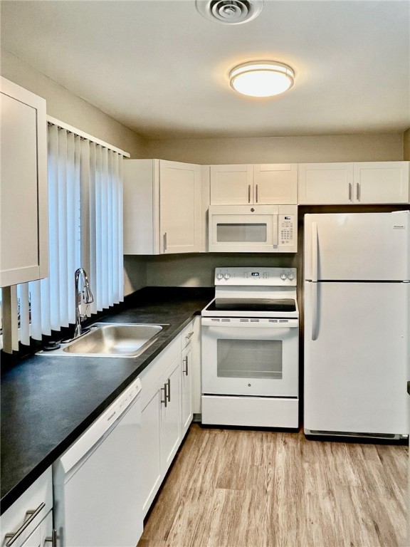 296 South Fitzhugh Street Rochester, NY 14608 - Photo 5 of 9 Typical kitchen with faux wood flooring, new cabin