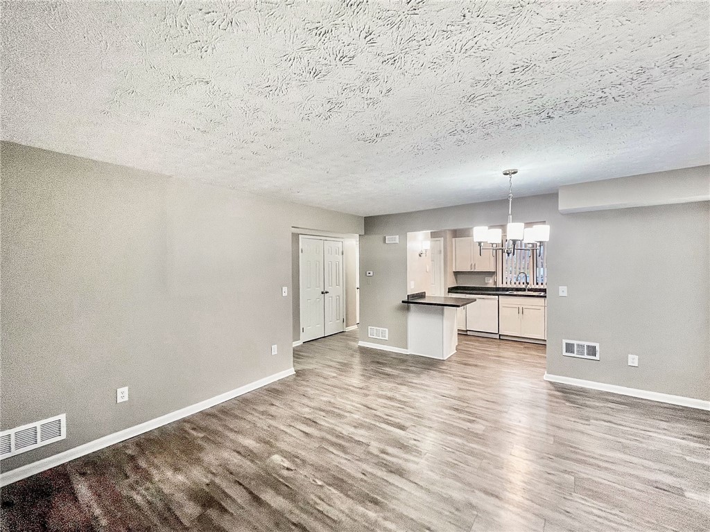 296 South Fitzhugh Street Rochester, NY 14608 - Photo 6 of 9 Typical view of Great Room towards kitchen and fro
