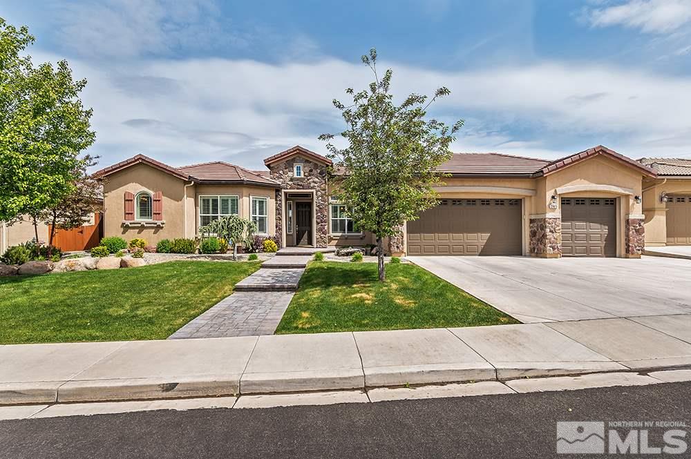 2905 Bull Rider Drive Reno, NV 89521 - Photo 1 of 33 a front view of a house with a yard and a garage