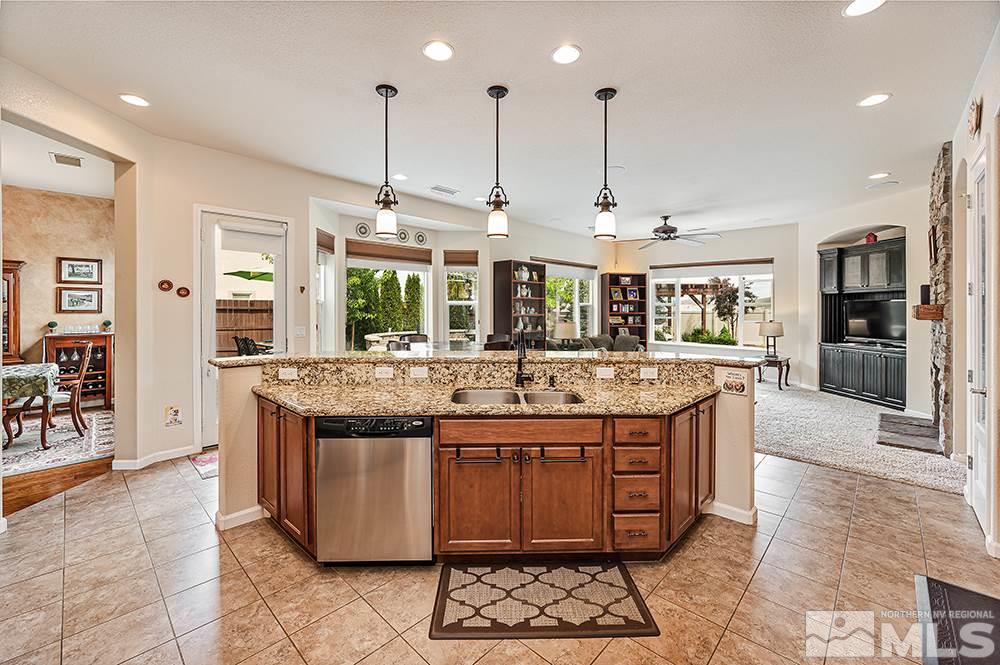 2905 Bull Rider Drive Reno, NV 89521 - Photo 15 of 33 a large kitchen with kitchen island a sink stove and refrigerator