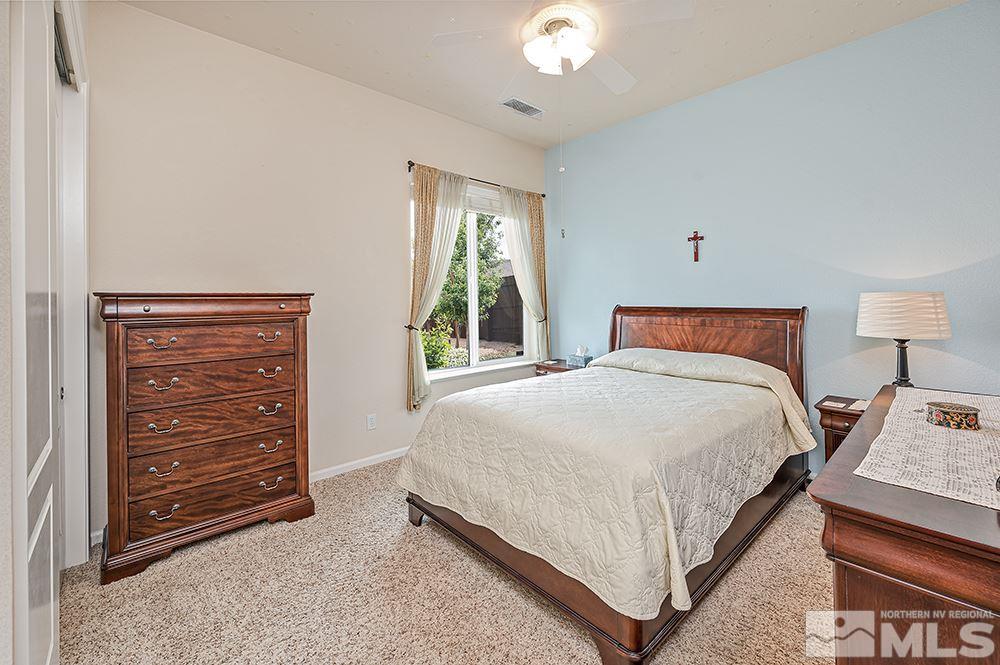 2905 Bull Rider Drive Reno, NV 89521 - Photo 21 of 33 a bedroom with a bed and a dresser