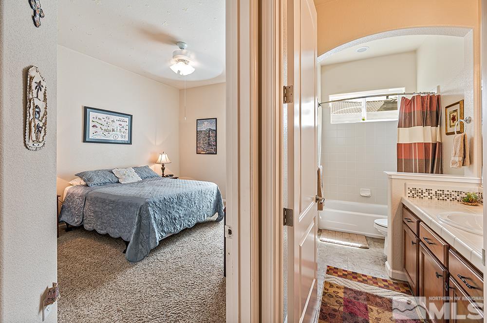 2905 Bull Rider Drive Reno, NV 89521 - Photo 25 of 33 a bedroom with a bed and a cabinets
