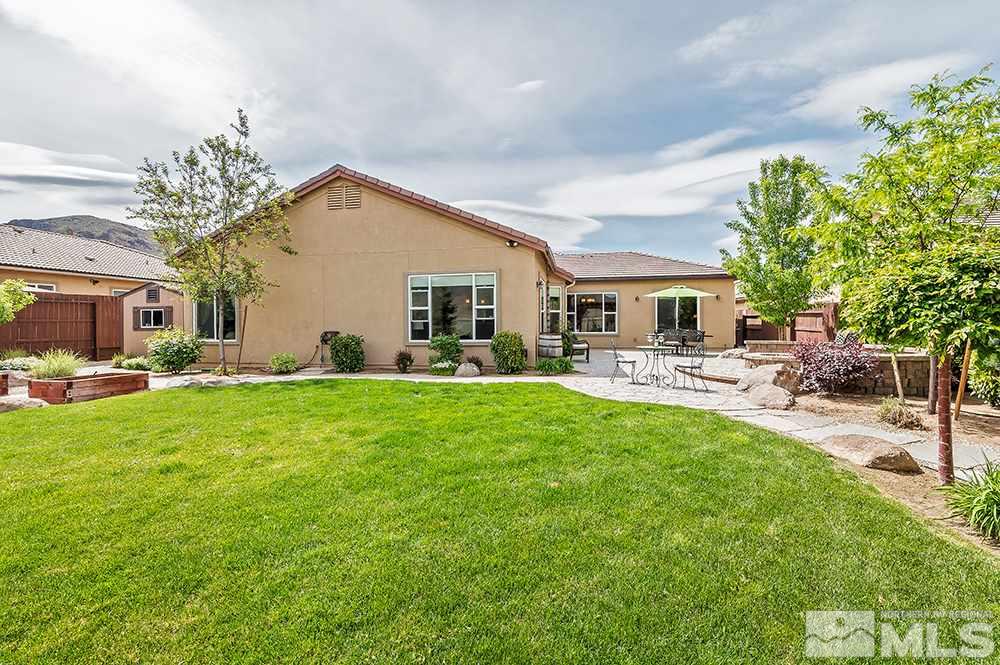2905 Bull Rider Drive Reno, NV 89521 - Photo 30 of 33 a backyard of a house with table and chairs