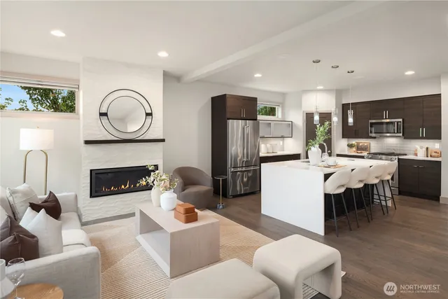 a living room with fireplace furniture and a fireplace