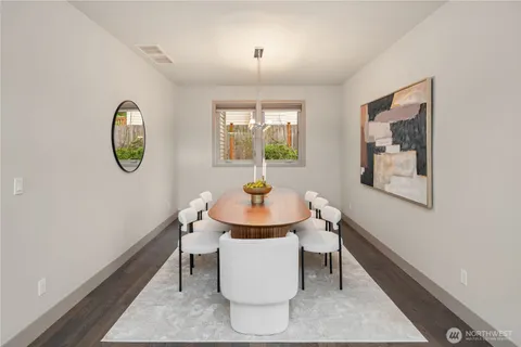 a dining room with furniture and window