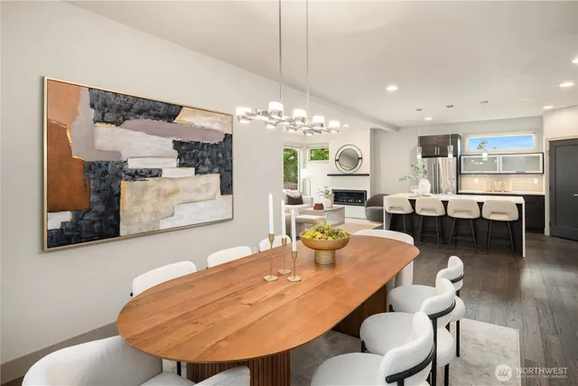 a dining room with furniture and wooden floor