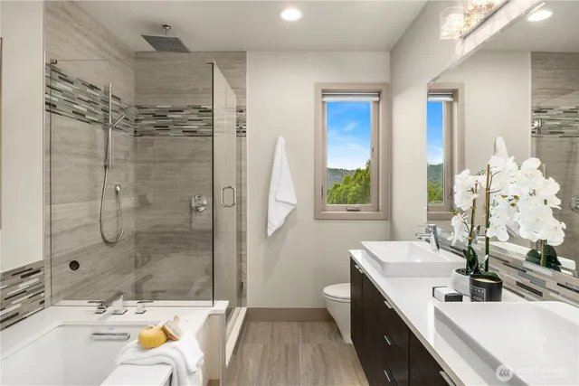 a bathroom with a tub sink and mirror