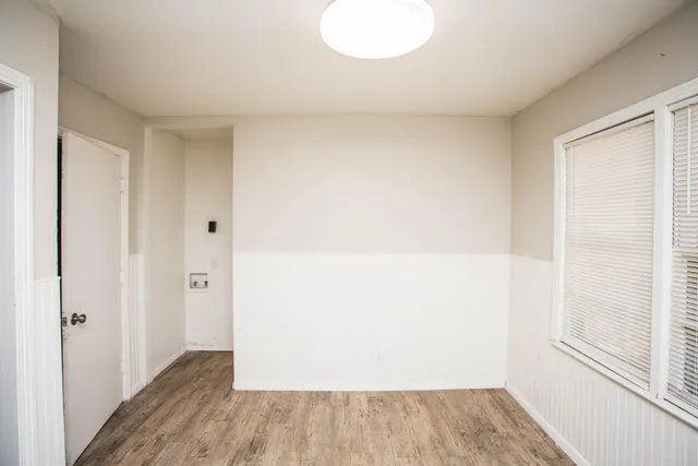 a view of small space with wooden floor