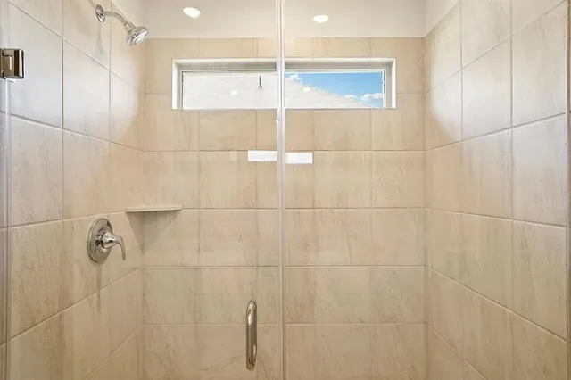 a bathroom with a sink double vanity and a mirror