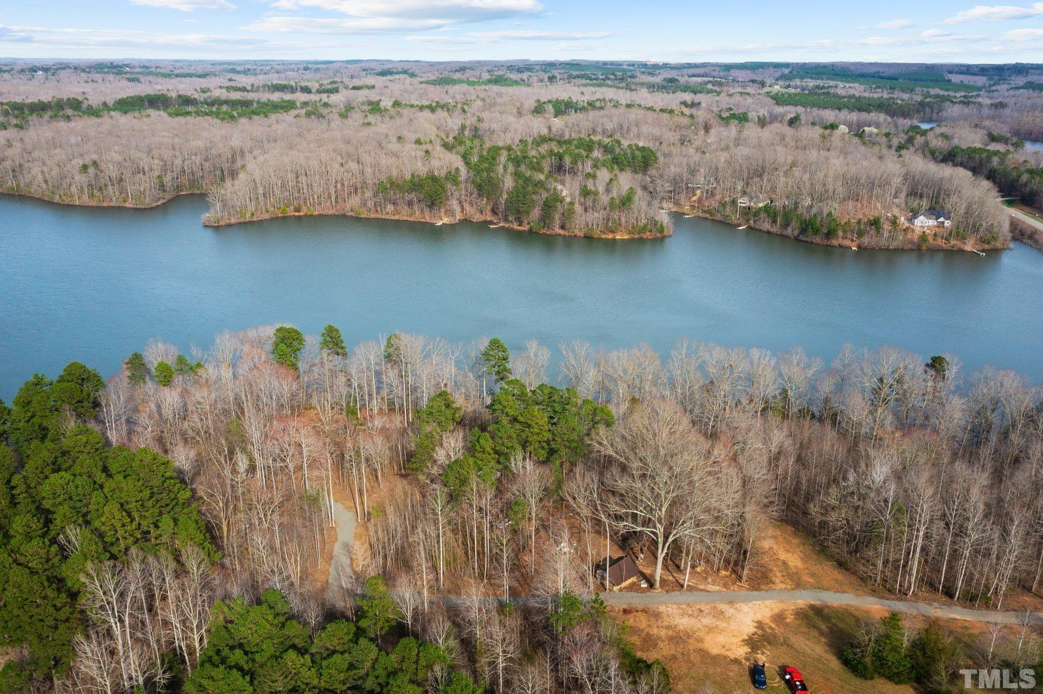2 Grapevine Drive Roxboro, NC 27574 - Photo 8 of 17 a view of a lake with a mountain in the background