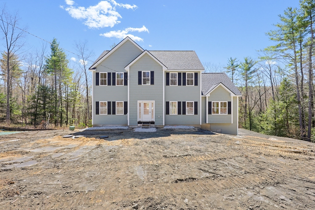 112 West Meadow Road Townsend, MA 01474 - Photo 32 of 38 a view of white house with a yard and potted plants