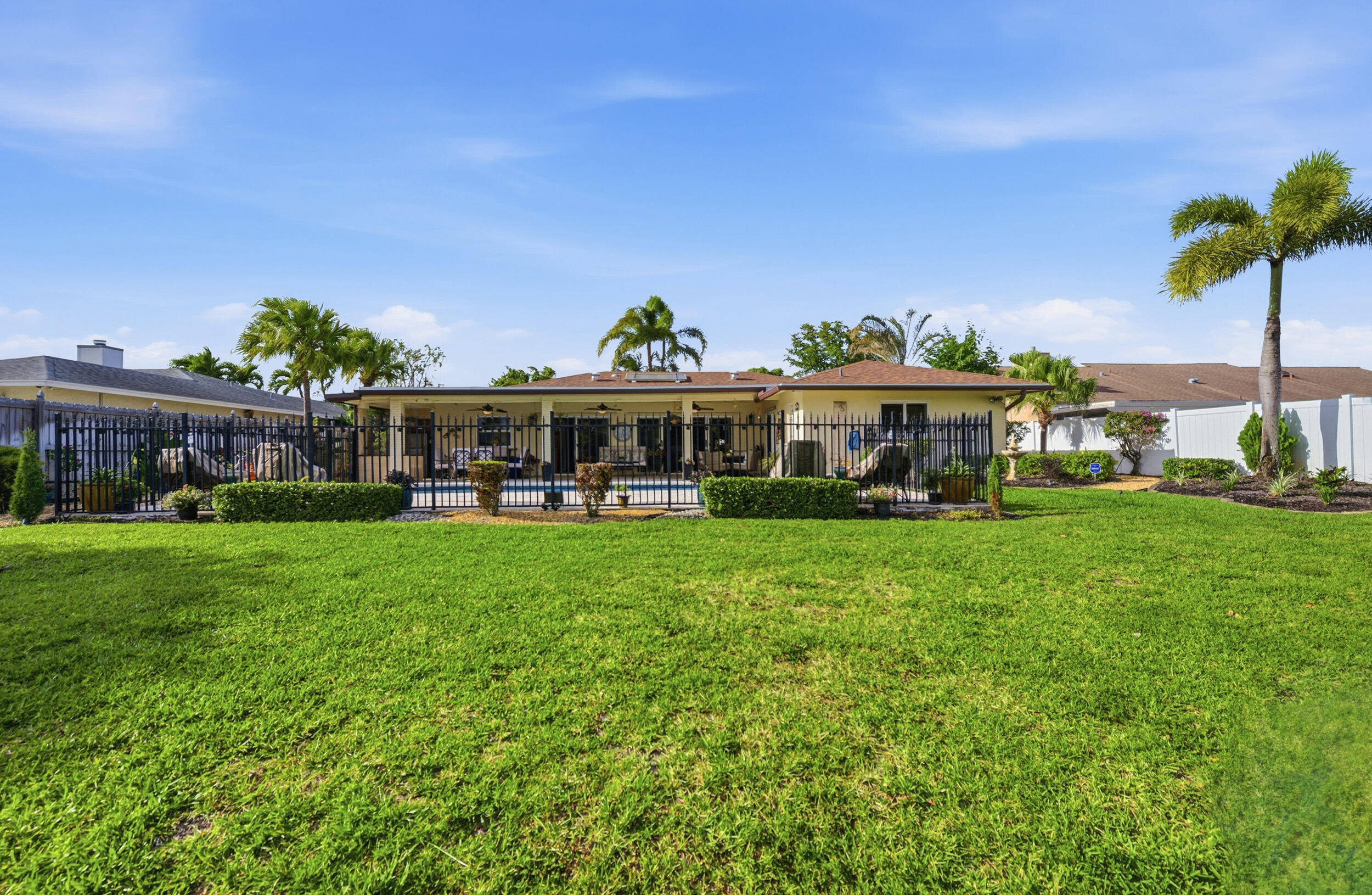 4780 Brandywine Drive Boca Raton, FL 33487 - Photo 33 of 43 a view of a yard in front of the house with a yard