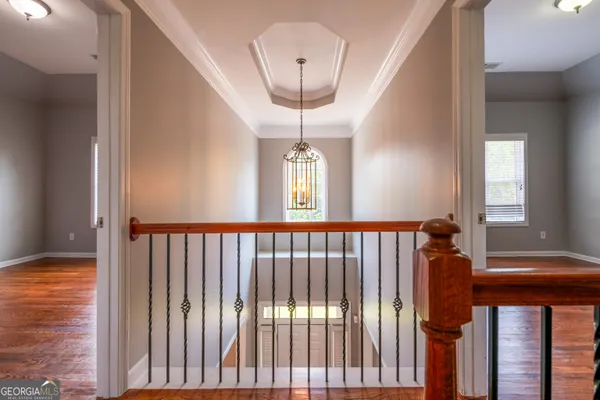 a room with pool table table and a chandelier