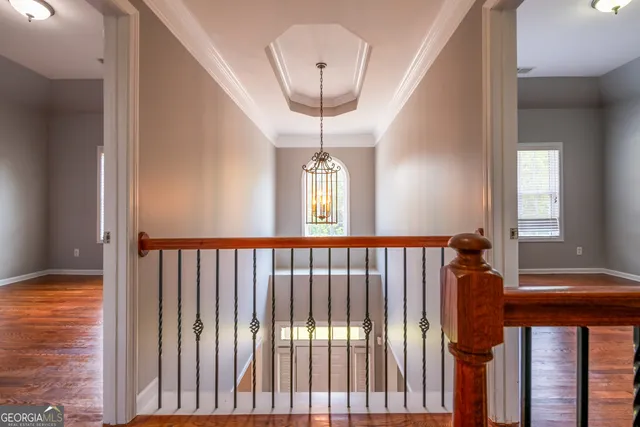 a room with pool table table and a chandelier