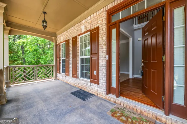 a view of an entryway with a floor to ceiling window