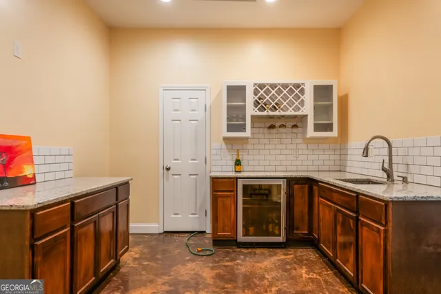 a view of a backyard with sitting area