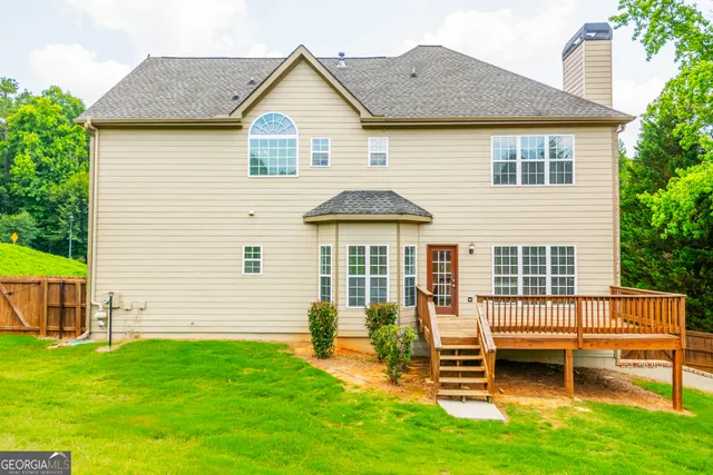 a view of a backyard with sitting area