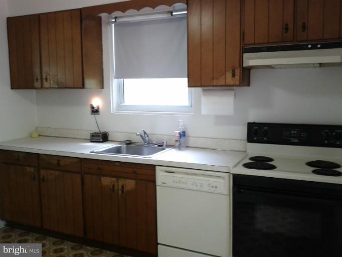 3611 Adams Drive Silver Spring, MD 20902 - Photo 1 of 16 a kitchen with stainless steel appliances granite countertop a sink stove and cabinets