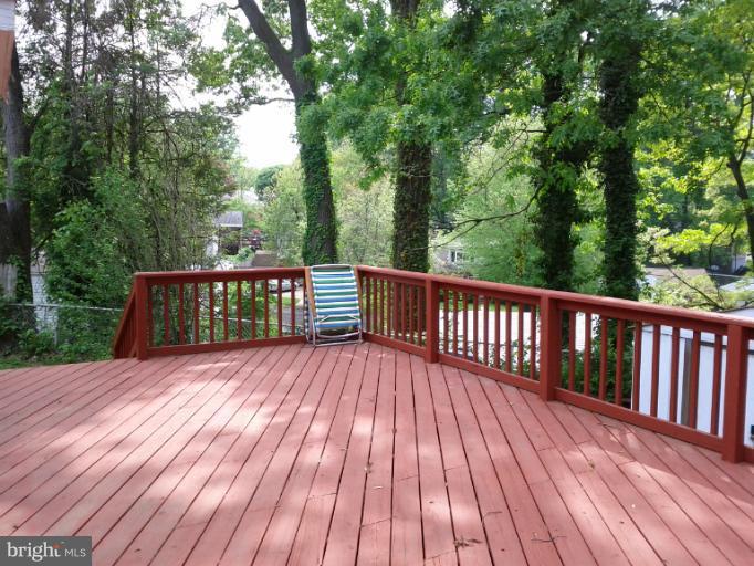 3611 Adams Drive Silver Spring, MD 20902 - Photo 13 of 16 a view of deck with wooden floor and outdoor seating