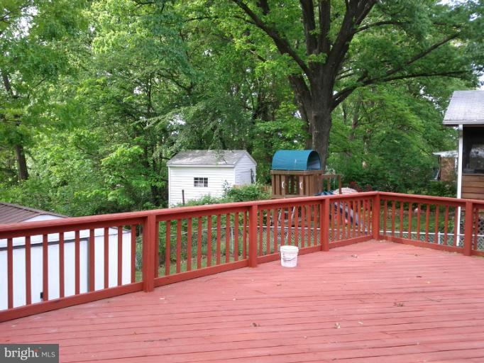 3611 Adams Drive Silver Spring, MD 20902 - Photo 10 of 16 a view of wooden deck and a garden