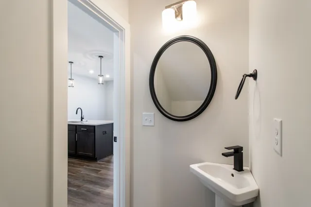 a bathroom with a sink and a mirror