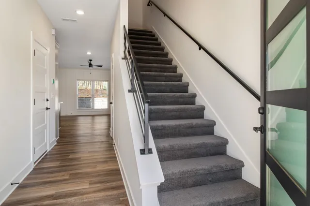 a view of entryway and hall with wooden floor