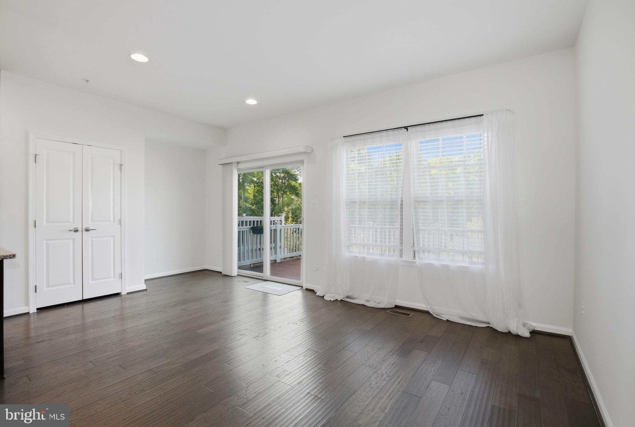 2784 Fredericksburg Road Hanover, MD 21076 - Photo 28 of 60 an empty room with wooden floor and windows