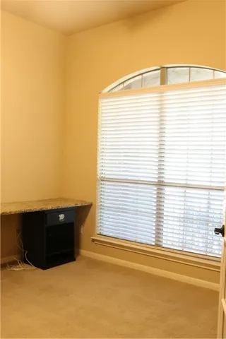 a view of a room with a window