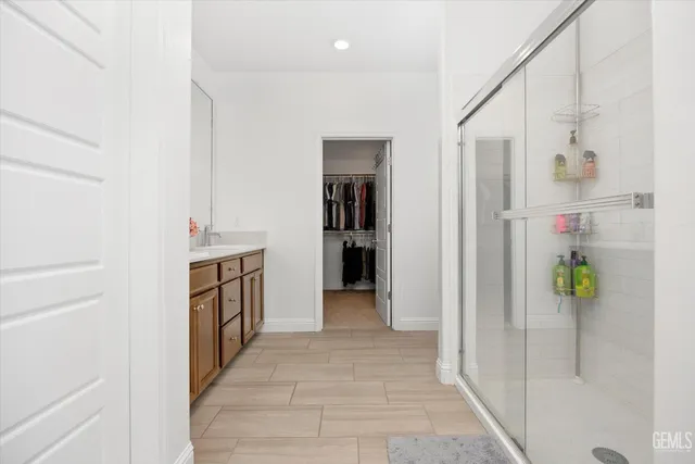 a hallway with cabinet and front door