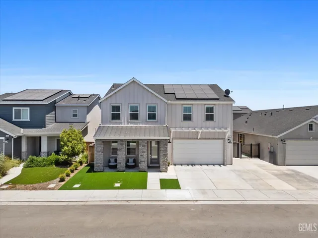 a view of multiple houses with a street