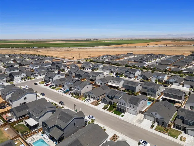an aerial view of residential building and ocean