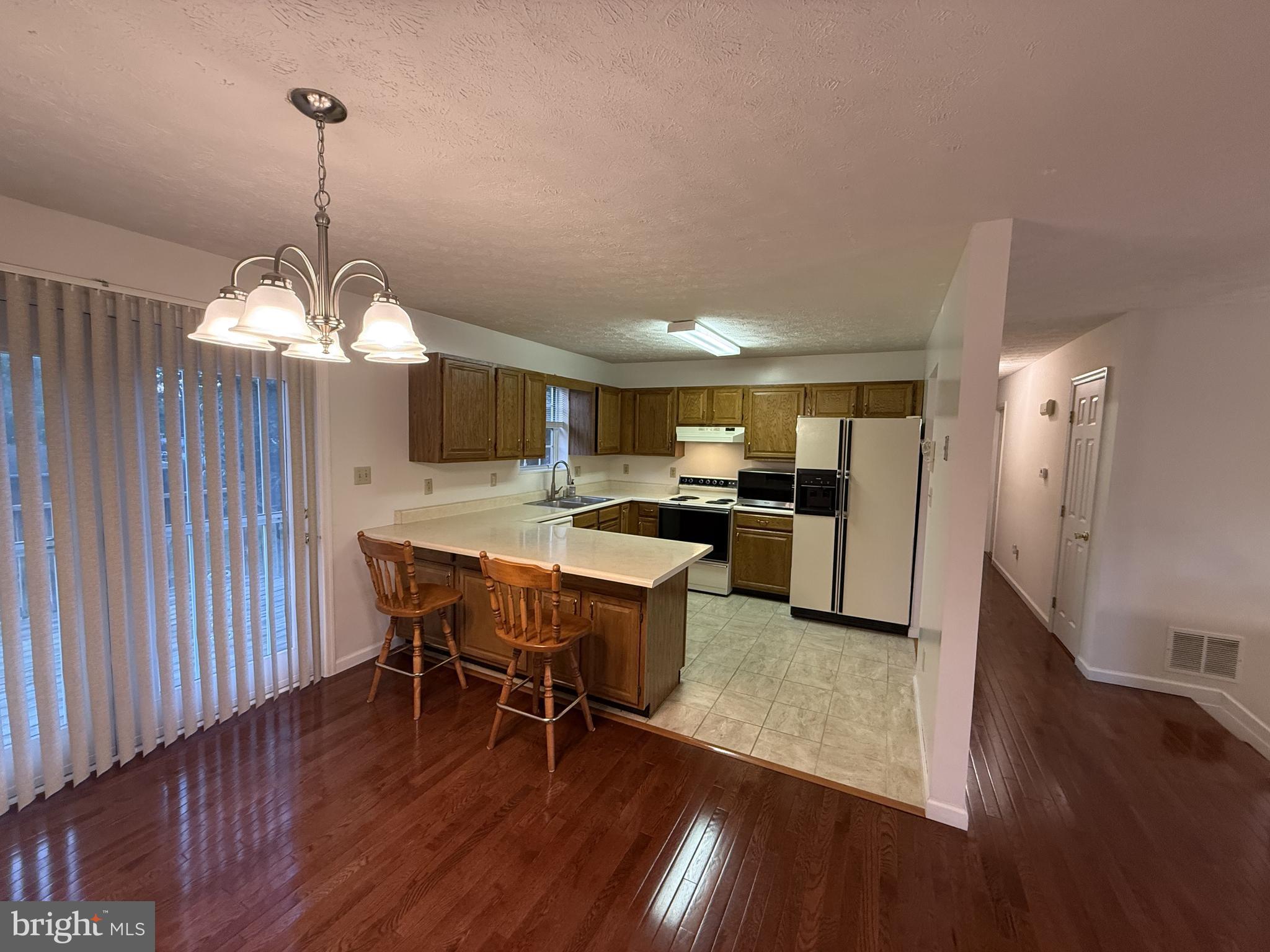 21 Coolidge Road Inwood, WV 25428 - Photo 29 of 80 Open-Concept Living, Dining & Kitchen Area