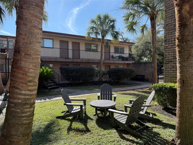 a swimming pool with outdoor seating