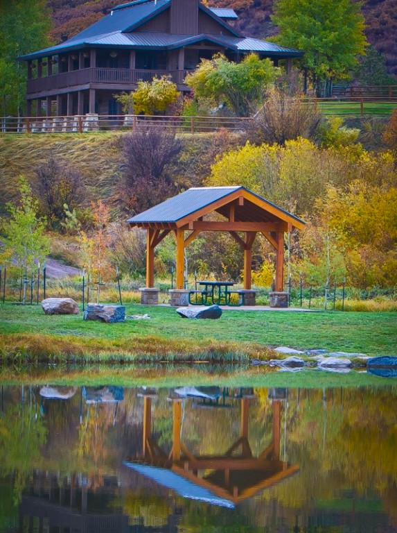 25060 Rainbow Ridge Oak Creek, CO 80467 - Photo 20 of 30 a view of a lake with a house in the background