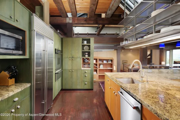 a kitchen with refrigerator and countertop