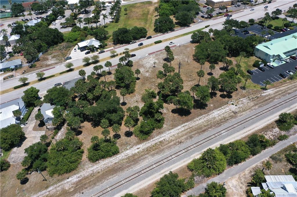 1531 Highway 1 Sebastian, FL 32958 - Photo 17 of 36 an aerial view of a house with a yard and mountain view in back