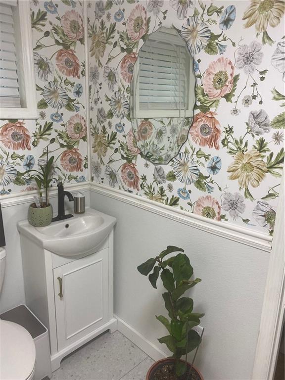1525 Sloppy Floyd Lake Road Summerville, GA 30747 - Photo 5 of 17 a bathroom with a sink and mirror with toilet
