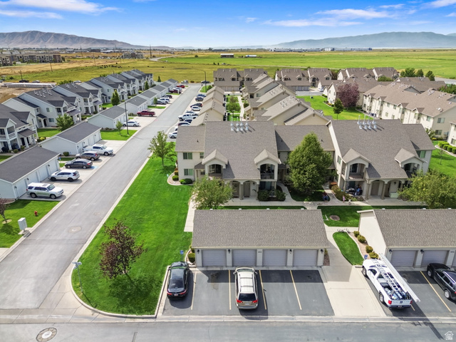 482 South 2500th West, Unit 2 Springville, UT 84663 - Photo 47 of 52 Residential community featuring pitched roofs, attached garages, paved roads, and landscaped green spaces