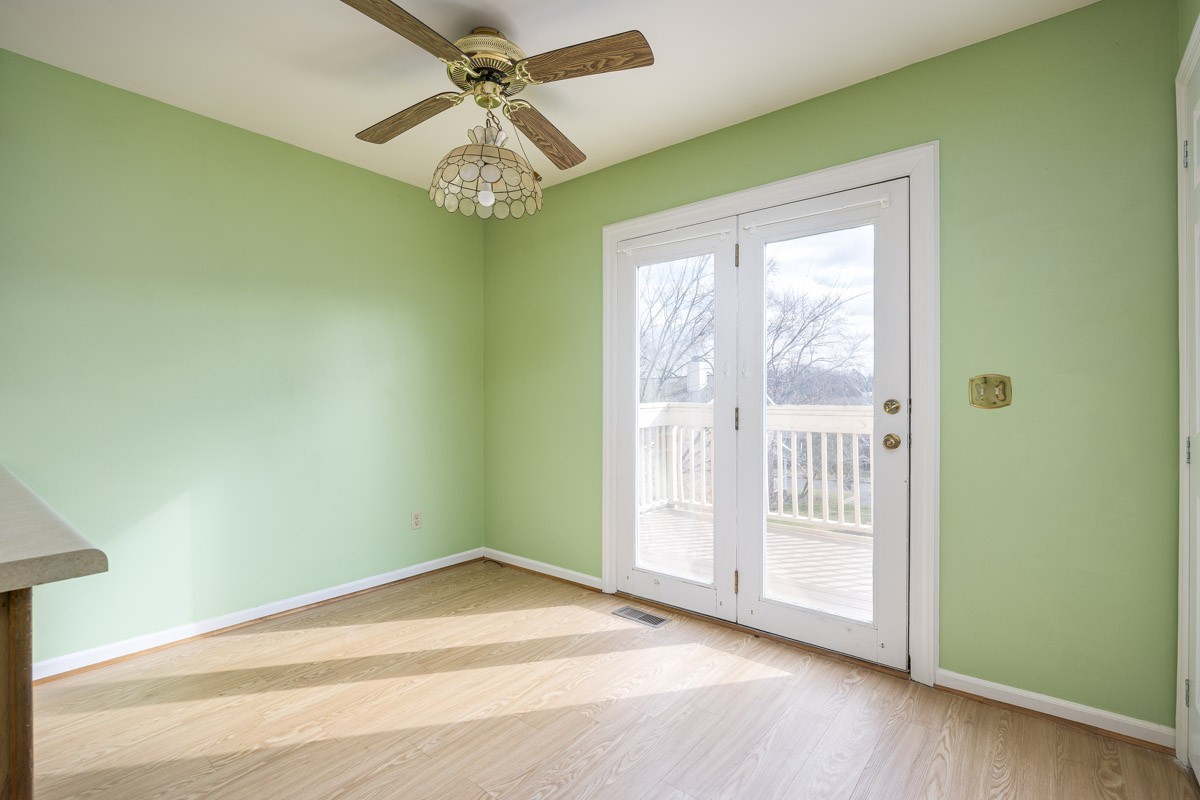 230 Pepper Ridge Circle Antioch, TN 37013 - Photo 8 of 21 en empty room with wooden floor and windows