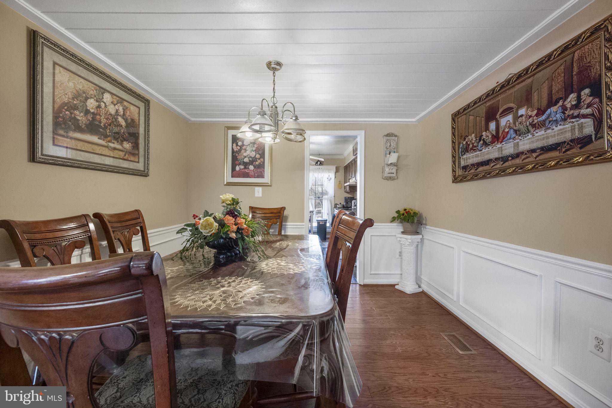 8527 Stonewall Road Manassas, VA 20110 - Photo 11 of 26 a view of a dining room with furniture