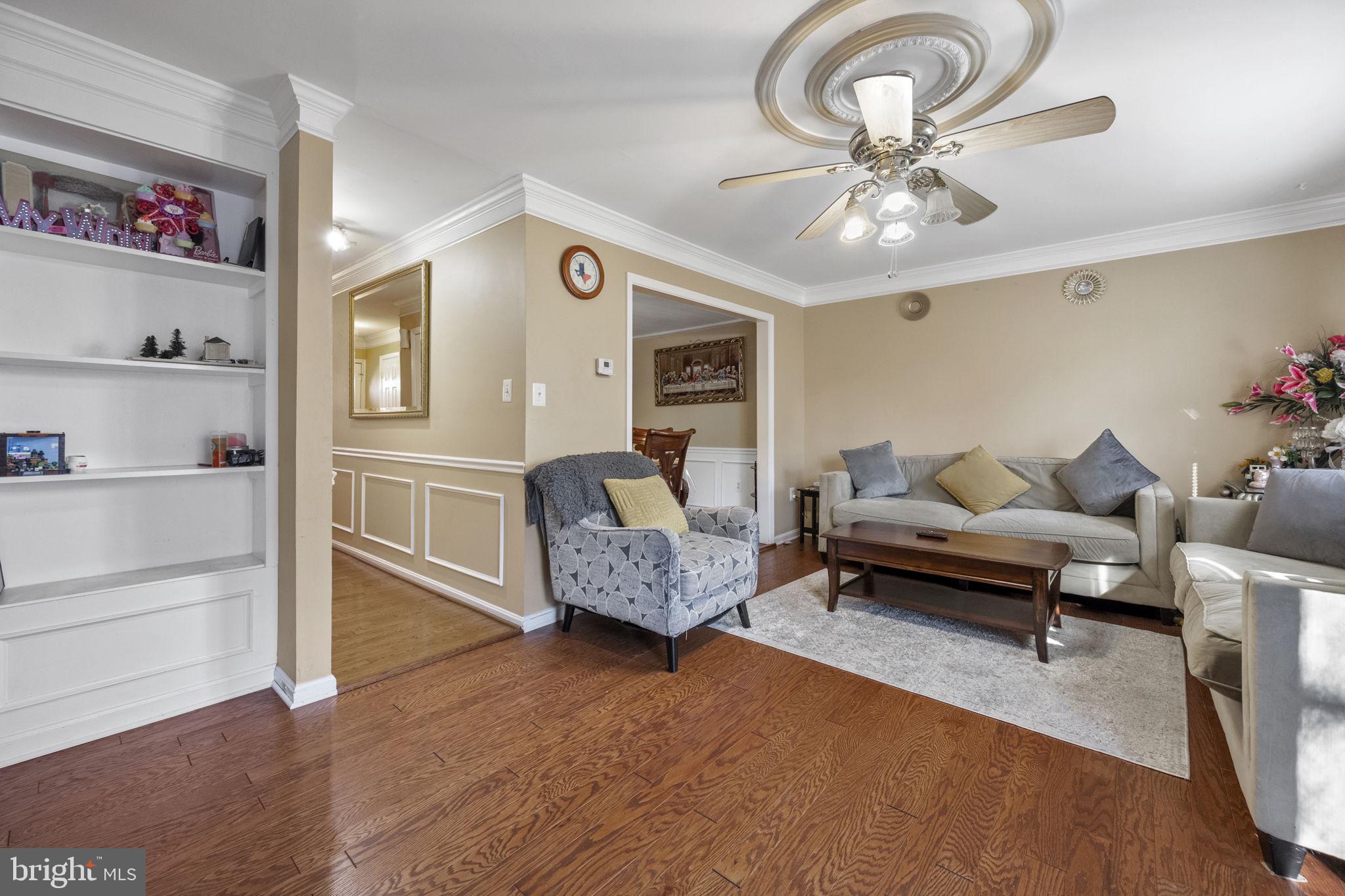 8527 Stonewall Road Manassas, VA 20110 - Photo 13 of 26 a living room with furniture and wooden floor