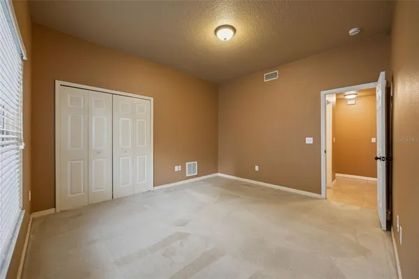 an empty room with closet area
