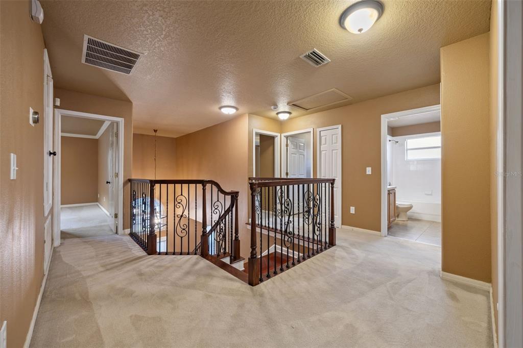 12112 Luftburrow Lane Hudson, FL 34669 - Photo 14 of 35 a view of a hallway with a livingroom and entryway