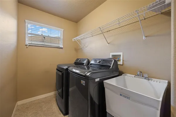 a utility room with dryer and washer