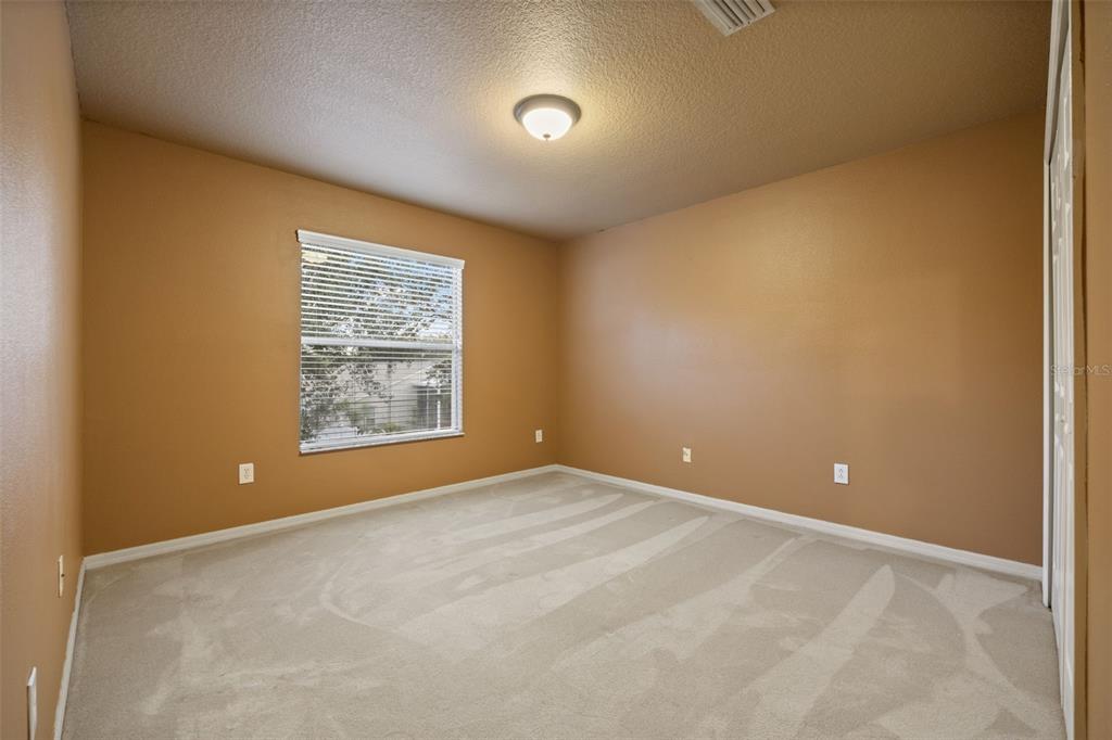 12112 Luftburrow Lane Hudson, FL 34669 - Photo 21 of 35 a view of an empty room with a window