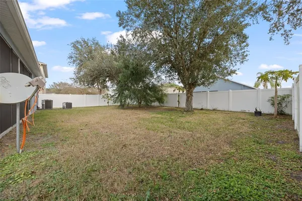 a house view with a backyard space