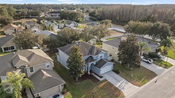 an aerial view of residential houses with outdoor space