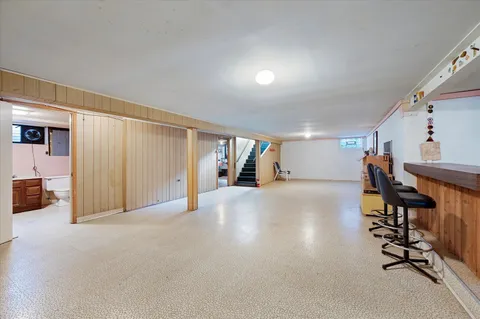 a view of a livingroom with entryway and furniture